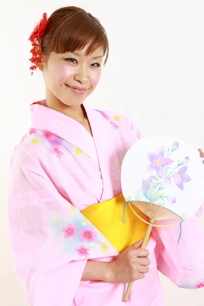 Young woman with paper Fan　 — ストック写真